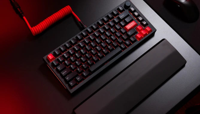 GPBT Kabuto keycaps on a Black Slate GMMK PRO keyboard with black wooden wrist rest and crimson red coiled cable